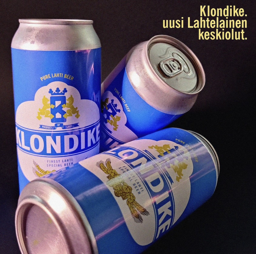 Klondike-oluttölkkejä ja teksti "Klondike. uusi Lahtelainen keskiolut"